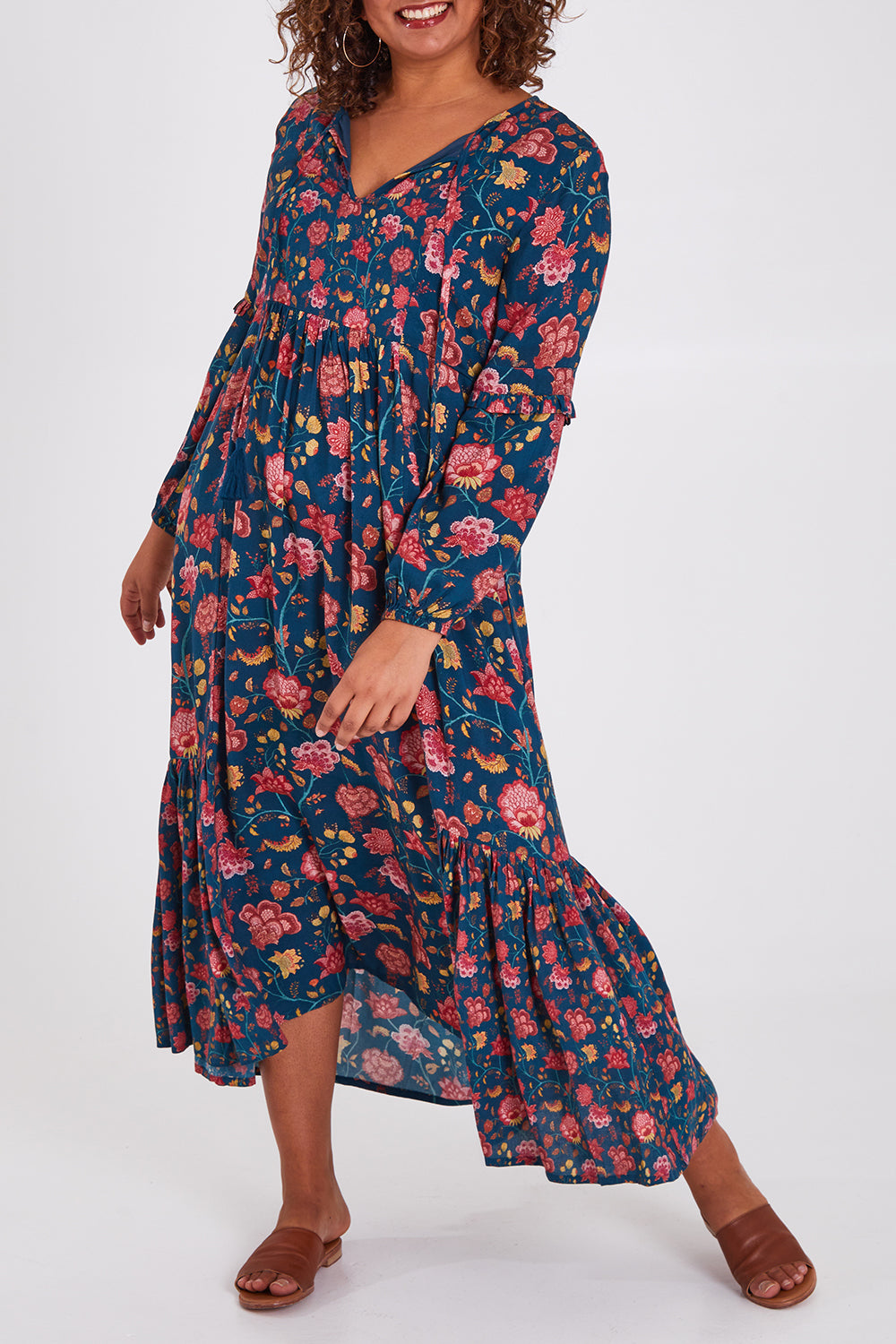 Model Anucia wearing size 14 of the Its Better With You Dress in colour Tealfleur (Blue), from the front, cropped image