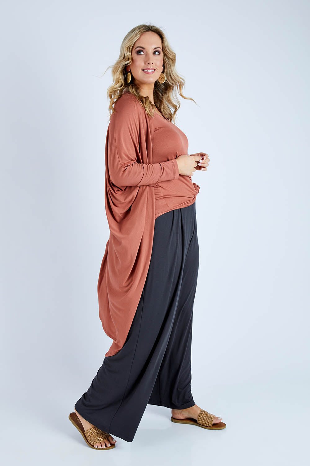 Model Jess wearing size 14 of the Falling For You Bamboo Cardi in colour Copper, from the front, showing the whole outfit