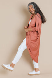 Model Nadine wearing size 10 of the Falling For You Bamboo Cardi in colour Copper, from the front, showing the whole outfit