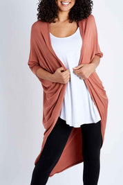 Model Pamela wearing size 10 of the Falling For You Bamboo Cardi in colour Copper, from the front, cropped image