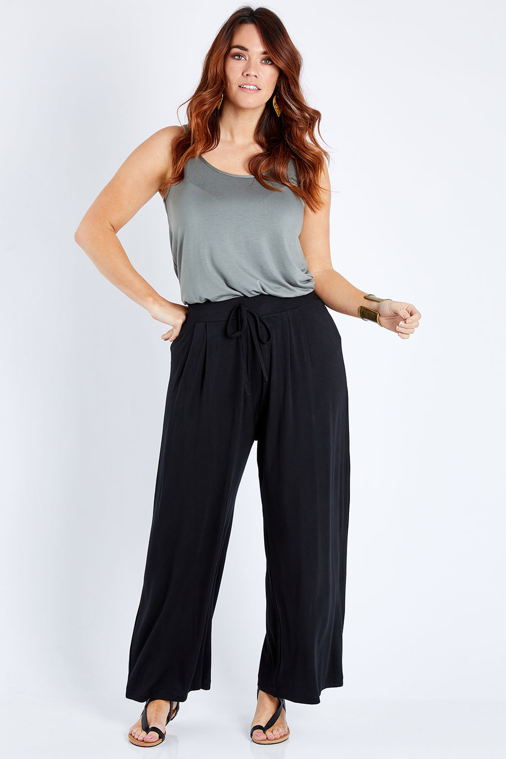 Model Laura wearing size 12 of the Softly Swinging Bamboo Pants in colour Black (Black), from the front, showing the whole outfit