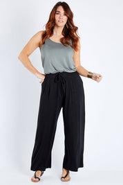 Model Laura wearing size 12 of the Softly Swinging Bamboo Pants in colour Black (Black), from the front, showing the whole outfit