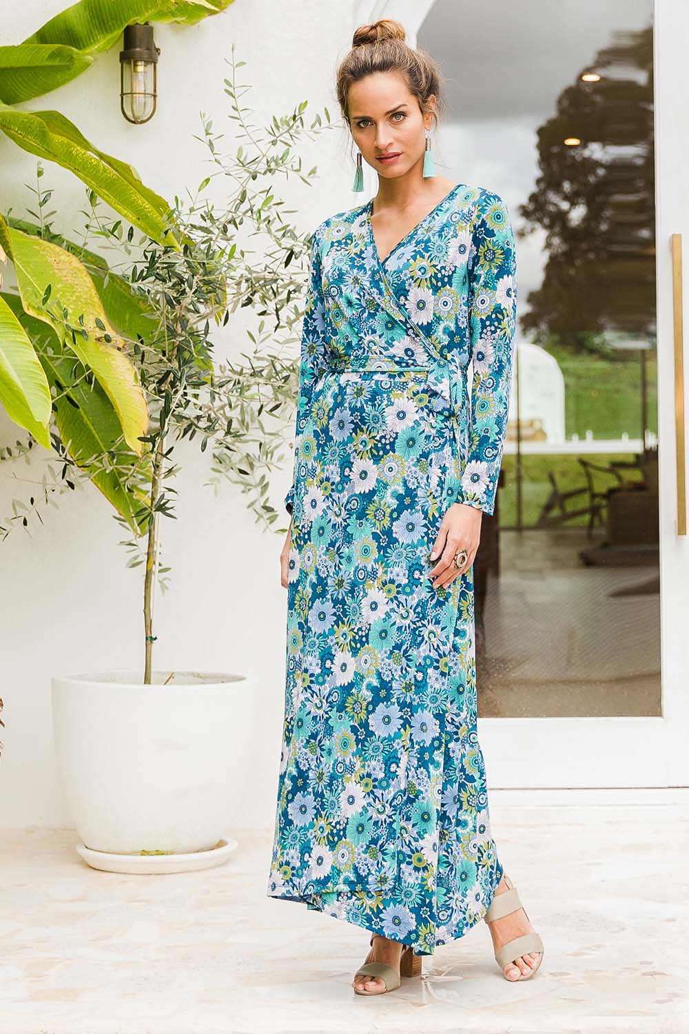 Model Ilona wearing size 10 of the Life Is Beautiful Wrap Maxi Dress in colour Bluefleur (Blue), from the front, showing the whole outfit