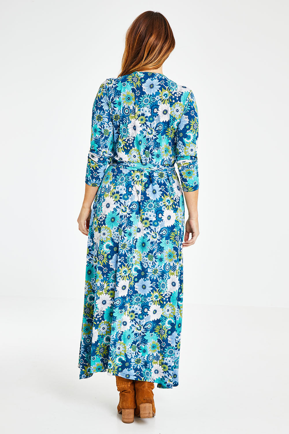 Model Laura wearing size 14 of the Life Is Beautiful Wrap Maxi Dress in colour Bluefleur (Blue), from the back