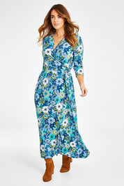Model Laura wearing size 14 of the Life Is Beautiful Wrap Maxi Dress in colour Bluefleur (Blue), from the front, showing the whole outfit