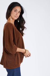 Model Gemma wearing size 10 of the Flow With Me Slouch Knit Top in colour Bark, from the front, cropped image