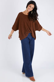 Model Gemma wearing size 10 of the Flow With Me Slouch Knit Top in colour Bark, from the front, showing the whole outfit