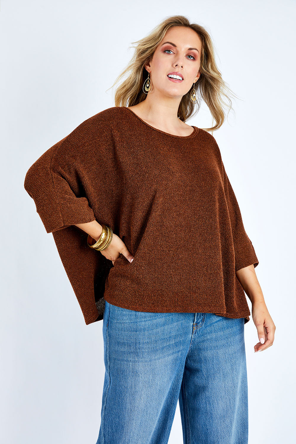 Model Jess wearing size 14 of the Flow With Me Slouch Knit Top in colour Bark, from the front, cropped image