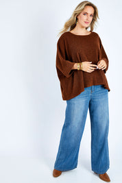 Model Jess wearing size 14 of the Flow With Me Slouch Knit Top in colour Bark, from the front, showing the whole outfit