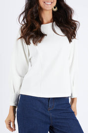 Model Gemma wearing size 10 of the Its All In The Sleeve Top in colour Ivory (White), from the front, cropped image