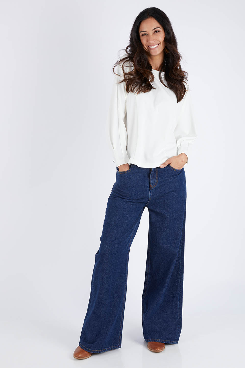 Model Gemma wearing size 10 of the Its All In The Sleeve Top in colour Ivory (White), from the front, showing the whole outfit