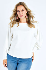 Model Jess wearing size 14 of the Its All In The Sleeve Top in colour Ivory (White), from the front, cropped image