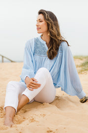 Model Amanda wearing size 10 of the Into The Sunshine Blouse in colour Skyblue (Blue), from the front, showing the whole outfit