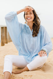 Model Amanda wearing size 10 of the Into The Sunshine Blouse in colour Skyblue (Blue), from the front, showing the whole outfit