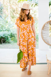 Model Ilona wearing size 10 of the Wild Garden Maxi Dress in colour Caramel, from the front, showing the whole outfit