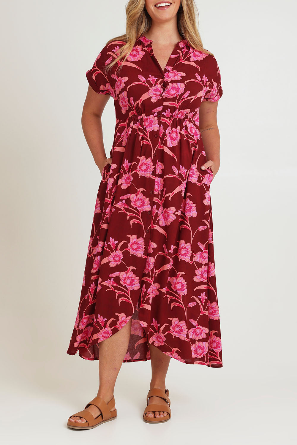 Model Chanel wearing size 16 of the Wild Garden Maxi Dress in colour Plumfleur (Pink), from the front, cropped image