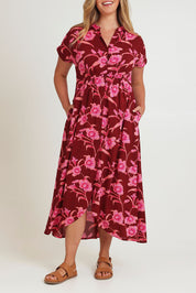 Model Chanel wearing size 16 of the Wild Garden Maxi Dress in colour Plumfleur (Pink), from the front, cropped image