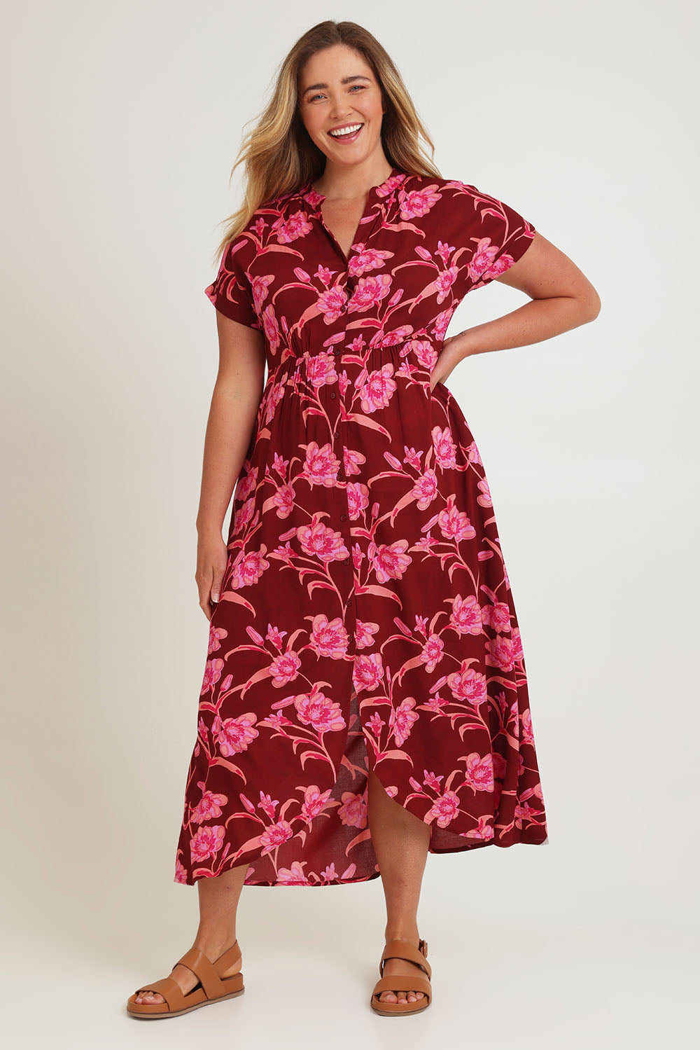 Model Chanel wearing size 16 of the Wild Garden Maxi Dress in colour Plumfleur (Pink), from the front, showing the whole outfit