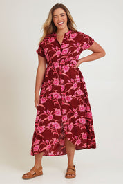 Model Chanel wearing size 16 of the Wild Garden Maxi Dress in colour Plumfleur (Pink), from the front, showing the whole outfit