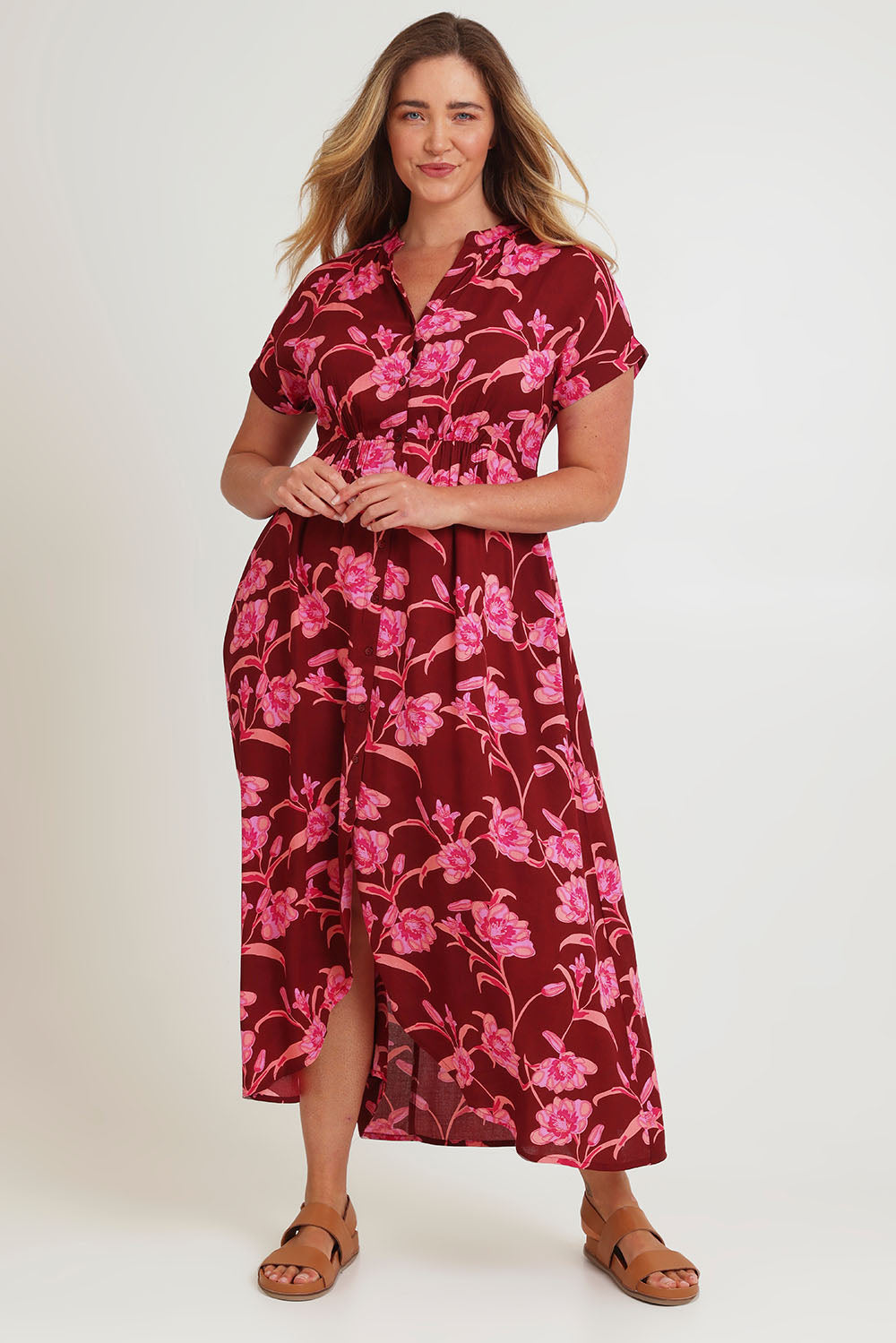 Model Chanel wearing size 16 of the Wild Garden Maxi Dress in colour Plumfleur (Pink), from the front, showing the whole outfit