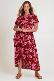 Model Chanel wearing size 16 of the Wild Garden Maxi Dress in colour Plumfleur (Pink), from the front, showing the whole outfit