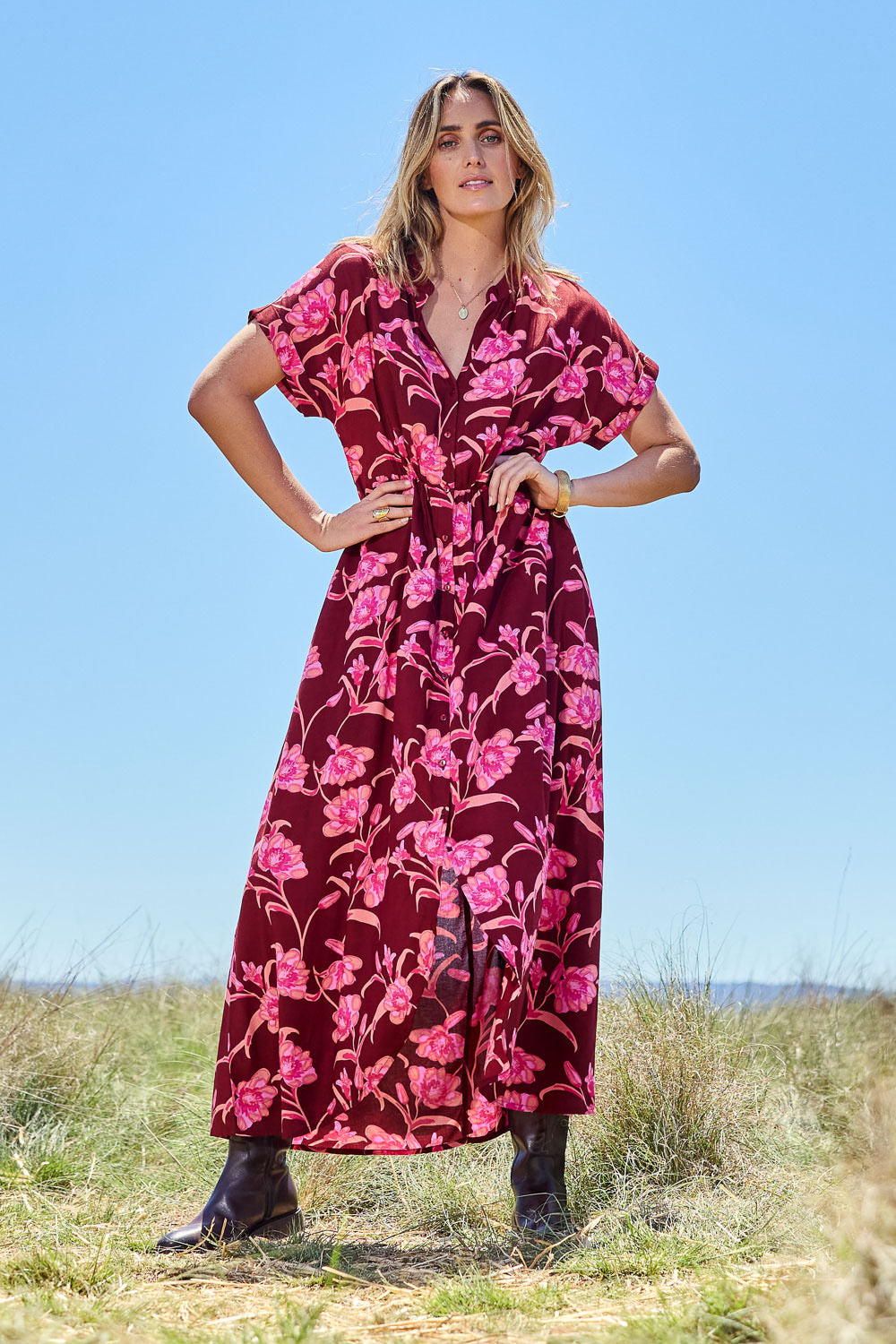 Model Tegan wearing size 10 of the Wild Garden Maxi Dress in colour Plumfleur (Pink), from the front, showing the whole outfit