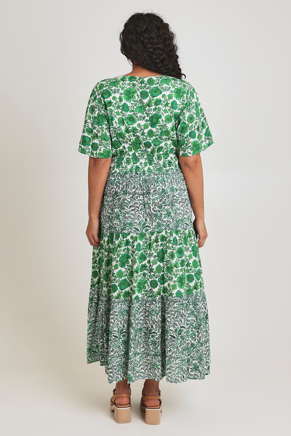 Model Terri-Leigh wearing size 14 of the Tiers Of Joy Maxi Dress in colour Greenfleur (Green), from the back