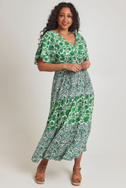 Model Terri-Leigh wearing size 14 of the Tiers Of Joy Maxi Dress in colour Greenfleur (Green), from the front, showing the whole outfit