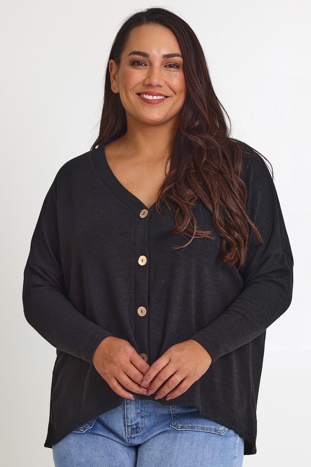 Model Ashleigh wearing size 16 of the My Boyfriends Slouch Cardi in colour Black (Black), from the front, cropped image