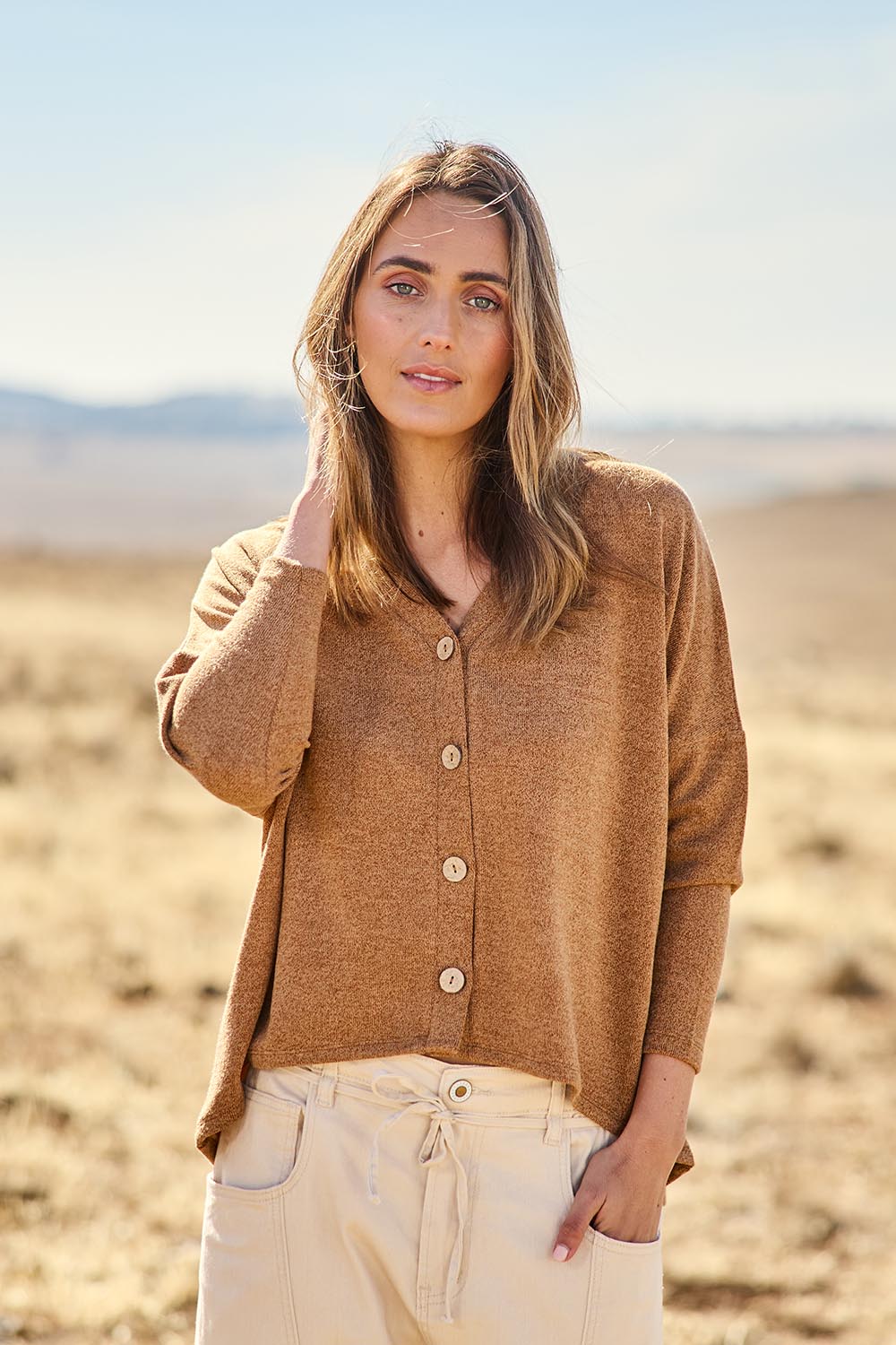 Model Tegan wearing size 10 of the My Boyfriends Slouch Cardi in colour Coffee, from the front, showing the whole outfit