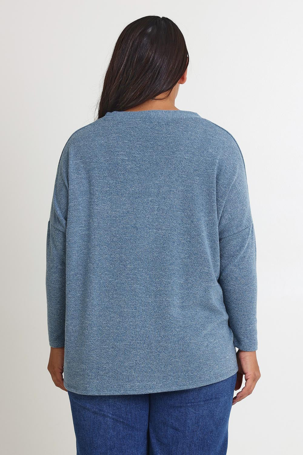 Model Ashleigh wearing size 16 of the My Boyfriends Slouch Cardi in colour Denim (Blue), from the back