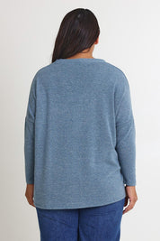 Model Ashleigh wearing size 16 of the My Boyfriends Slouch Cardi in colour Denim (Blue), from the back