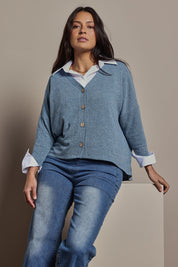 Model Tahnee wearing size 10 of the My Boyfriends Slouch Cardi in colour Denim (Blue), from the front, cropped image