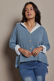 Model Tahnee wearing size 10 of the My Boyfriends Slouch Cardi in colour Denim (Blue), from the front, cropped image