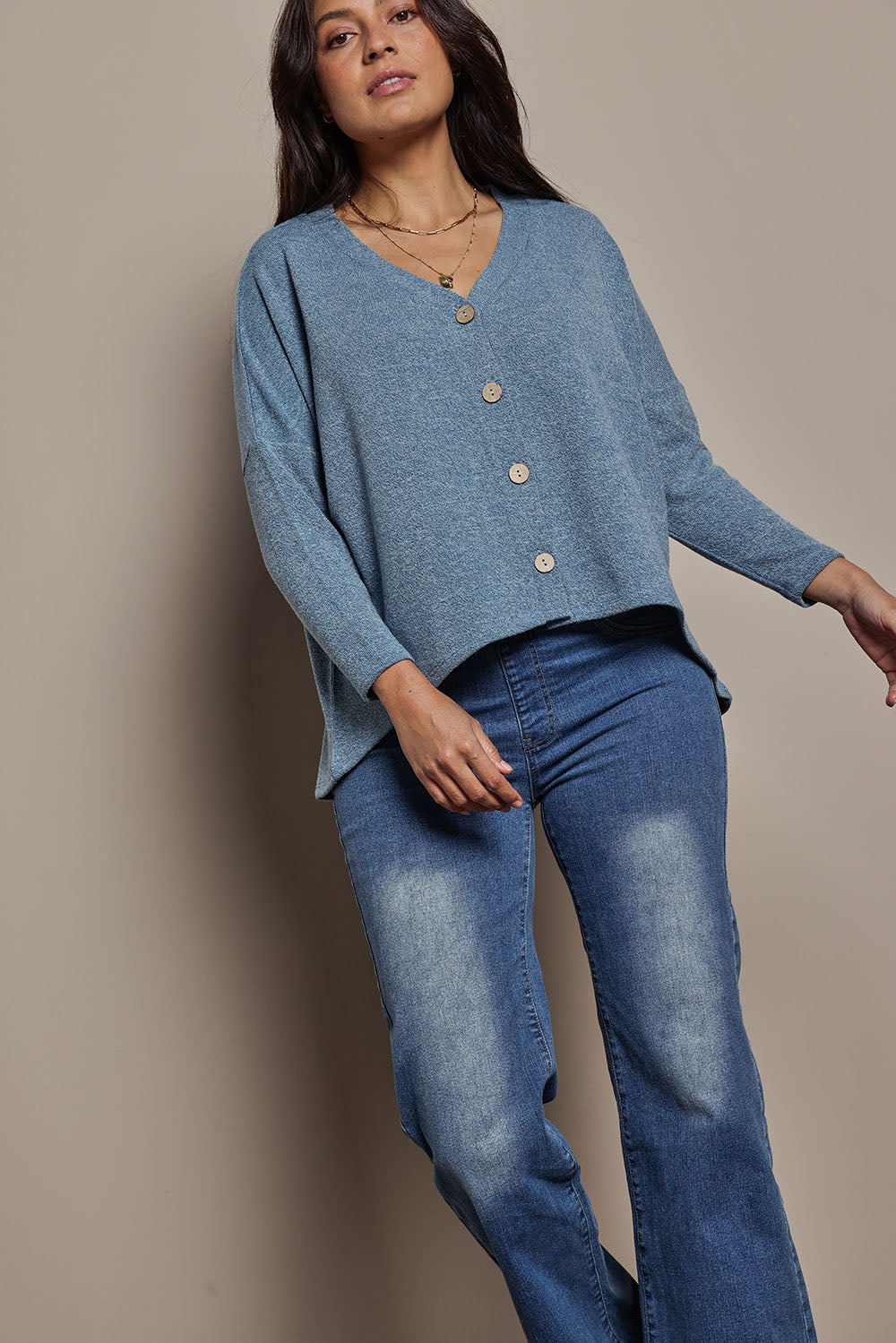 Model Tahnee wearing size 10 of the My Boyfriends Slouch Cardi in colour Denim (Blue), from the front, cropped image