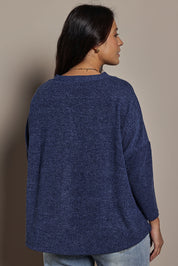 Model Tahnee wearing size 10 of the My Boyfriends Slouch Cardi in colour Indigo (Blue), from the back