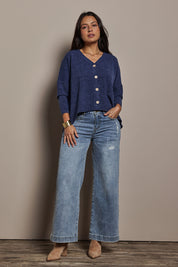 Model Tahnee wearing size 10 of the My Boyfriends Slouch Cardi in colour Indigo (Blue), from the front, showing the whole outfit