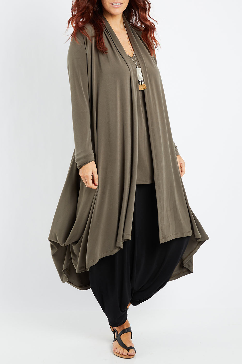 Model Laura wearing size 14 of The Wanderer In Me Swing Travel Cardi in colour Khaki (Green), from the front, cropped image