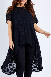 Model Laura wearing size 14 of the Walking On Clouds Jacquard Top in colour Black (Black), from the front, cropped image