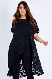 Model Laura wearing size 14 of the Walking On Clouds Jacquard Top in colour Black (Black), from the front, cropped image