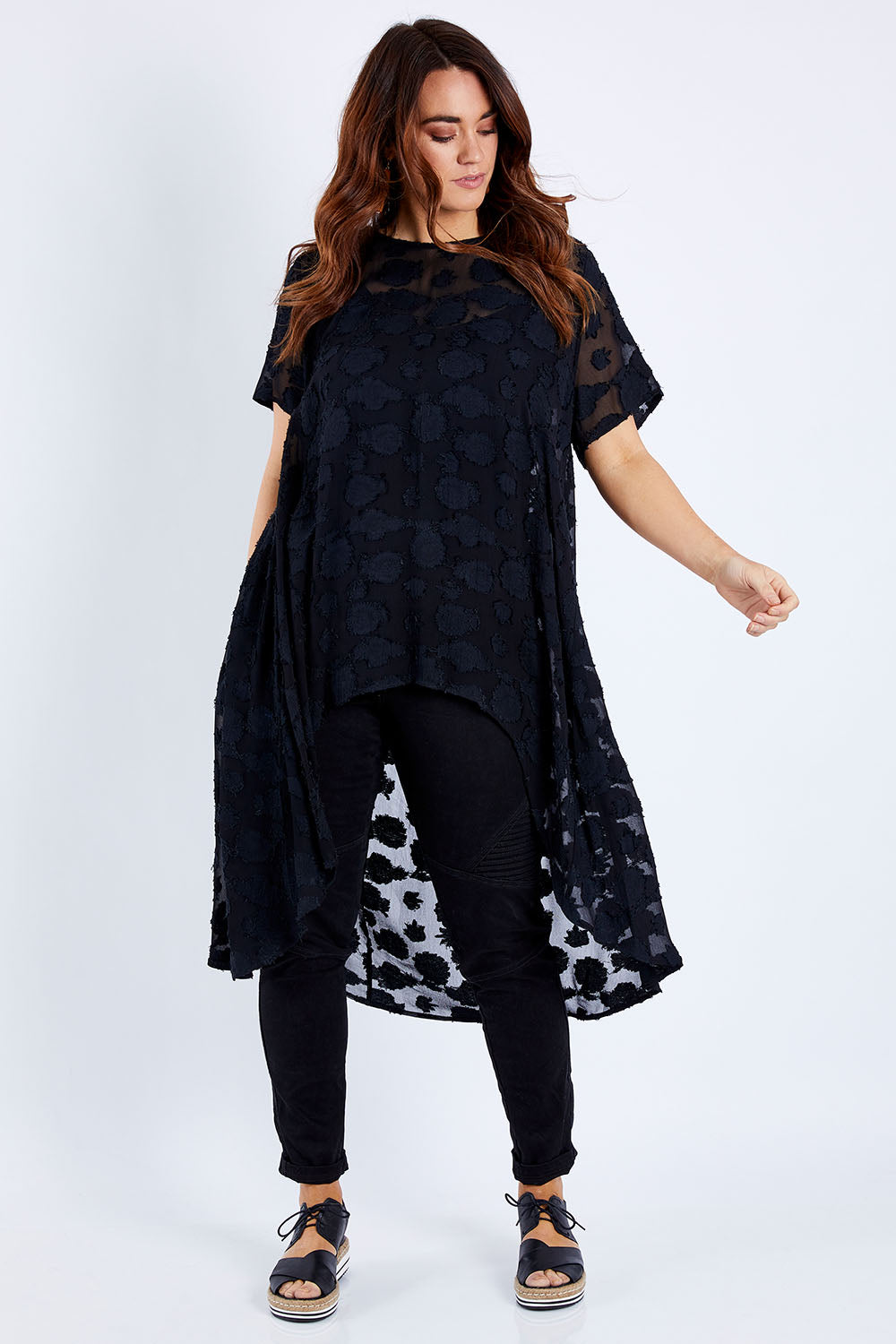 Model Laura wearing size 14 of the Walking On Clouds Jacquard Top in colour Black (Black), from the front, showing the whole outfit