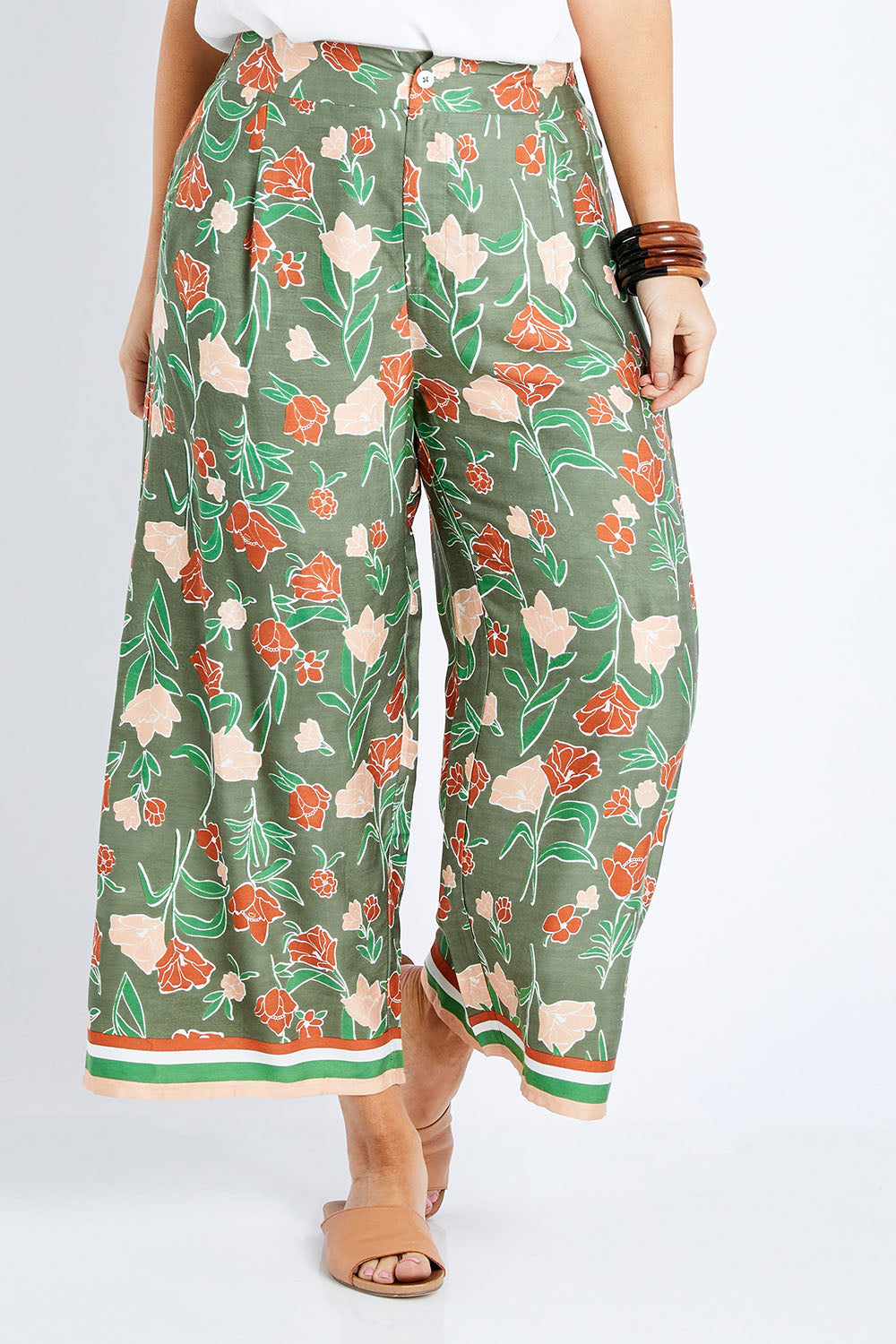 Model Laura wearing size 14 of the My Heart Is Full Flower Pants in colour Khaki (Green), from the front, cropped image