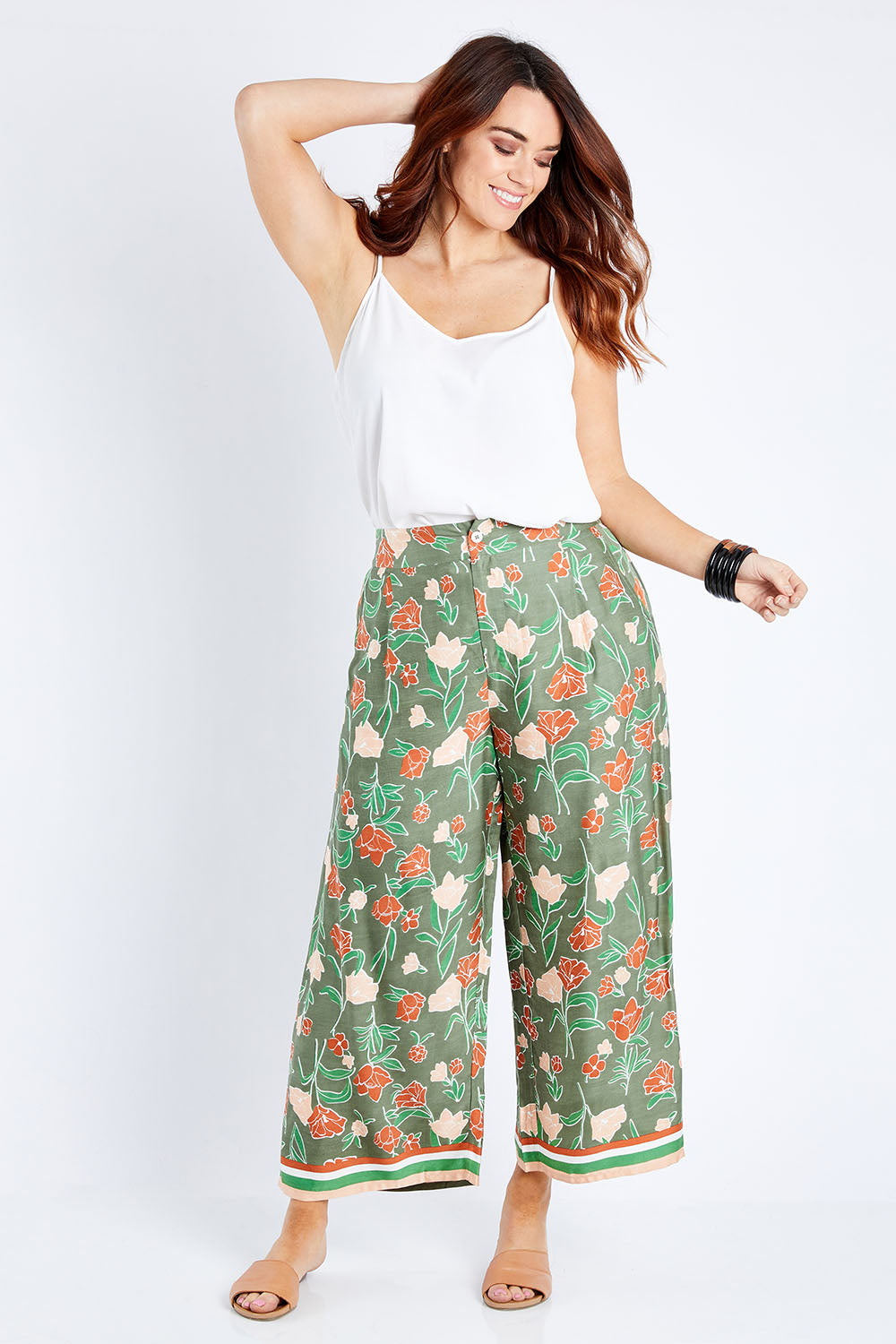 Model Laura wearing size 14 of the My Heart Is Full Flower Pants in colour Khaki (Green), from the front, showing the whole outfit