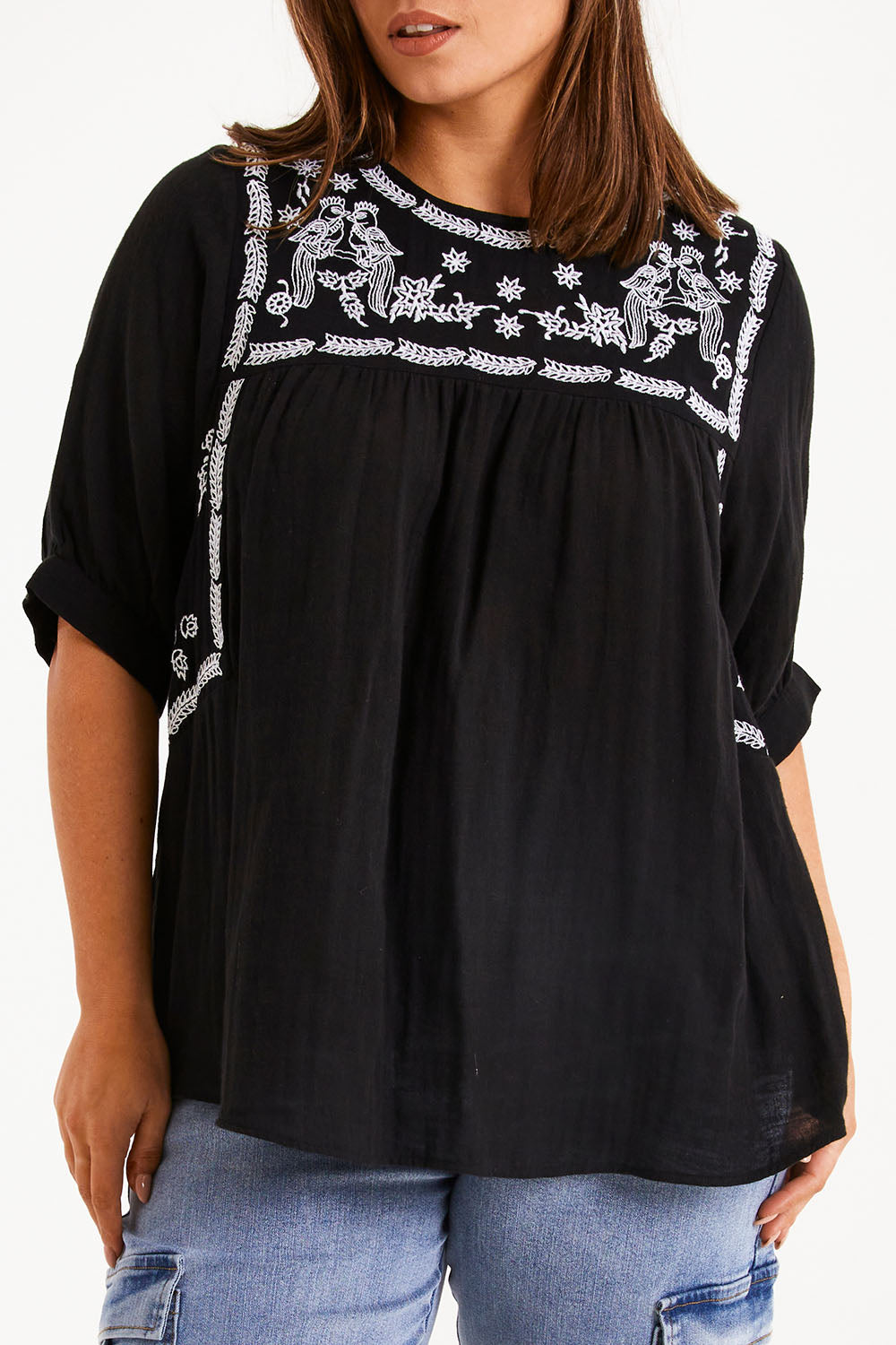 Model Monique wearing size 14 of the Secret Garden Cotton Blouse in colour Black (Black), from the front, cropped image