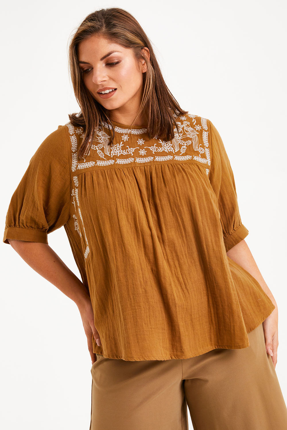 Model Monique wearing size 14 of the Secret Garden Cotton Blouse in colour Clay, from the front, cropped image