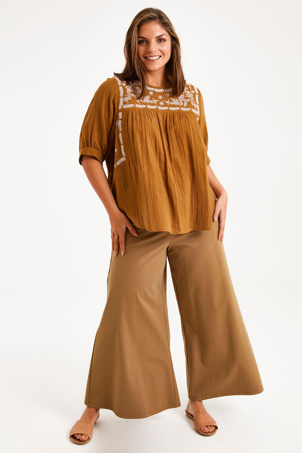 Model Monique wearing size 14 of the Secret Garden Cotton Blouse in colour Clay, from the front, showing the whole outfit