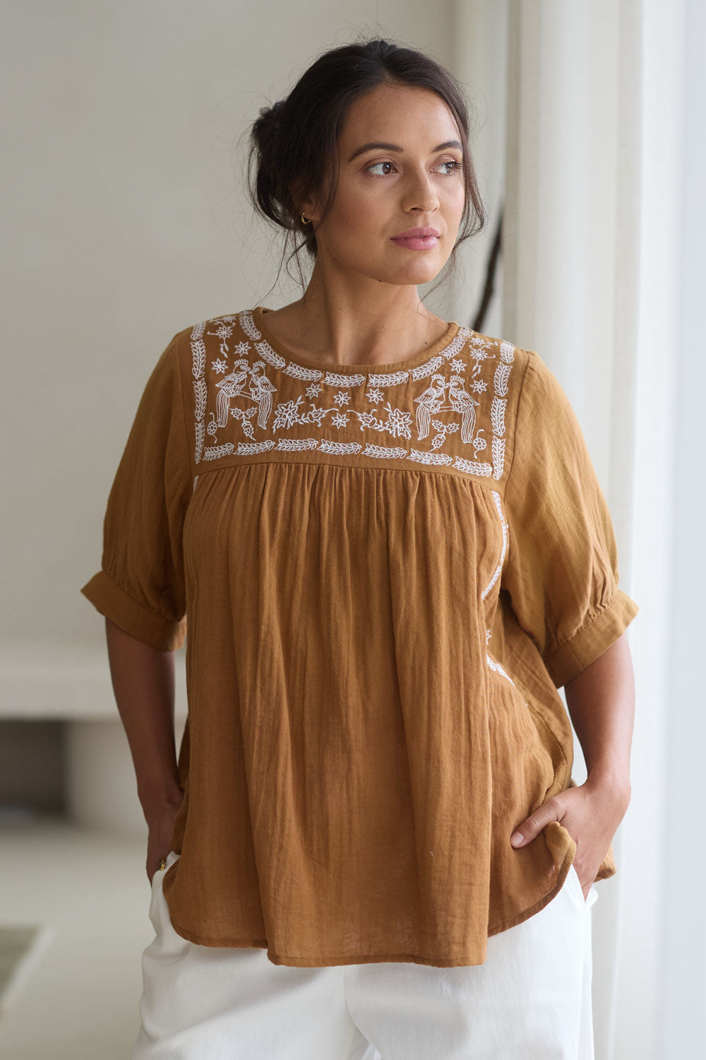 Model Tahnee wearing size 10 of the Secret Garden Cotton Blouse in colour Clay, from the front, showing the whole outfit
