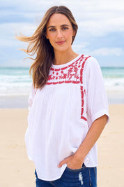 Model Tegan wearing size 10 of the Secret Garden Cotton Blouse in colour White (White), from the front, showing the whole outfit