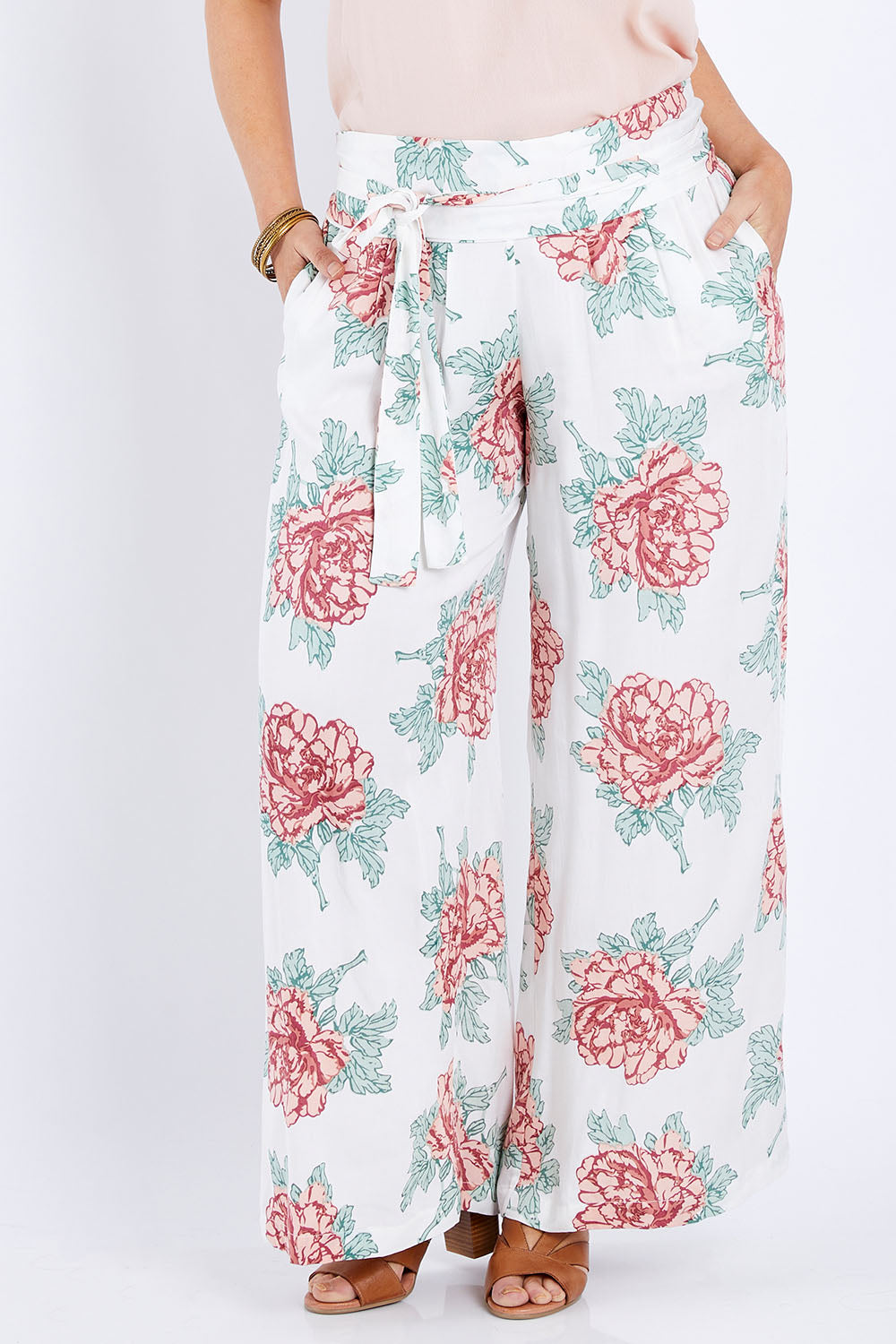 Model Laura wearing size 14 of the Flowers For Me Pants in colour Whitefleur (White), from the front, cropped image