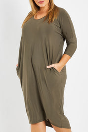 Model Fiona wearing size 16 of The Wanderer In Me Travel Dress in colour Khaki (Green), from the front, cropped image